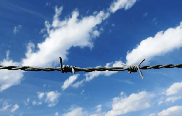 Barbed wire with blue sky