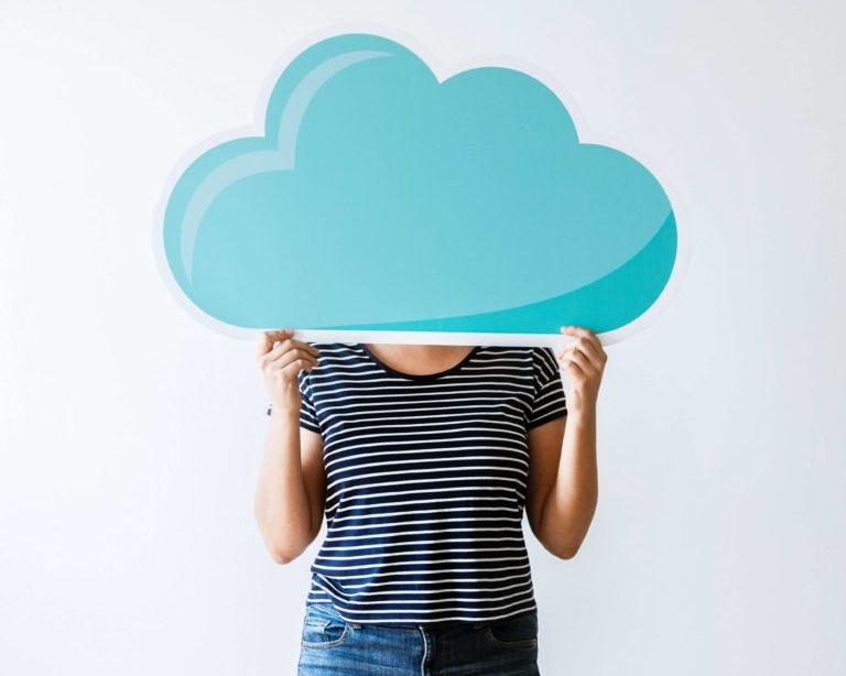 woman holding up cloud, cloud computing