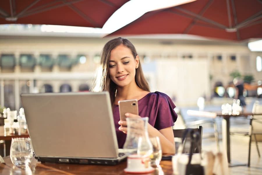 Woman using public Wi-Fi at restaurant