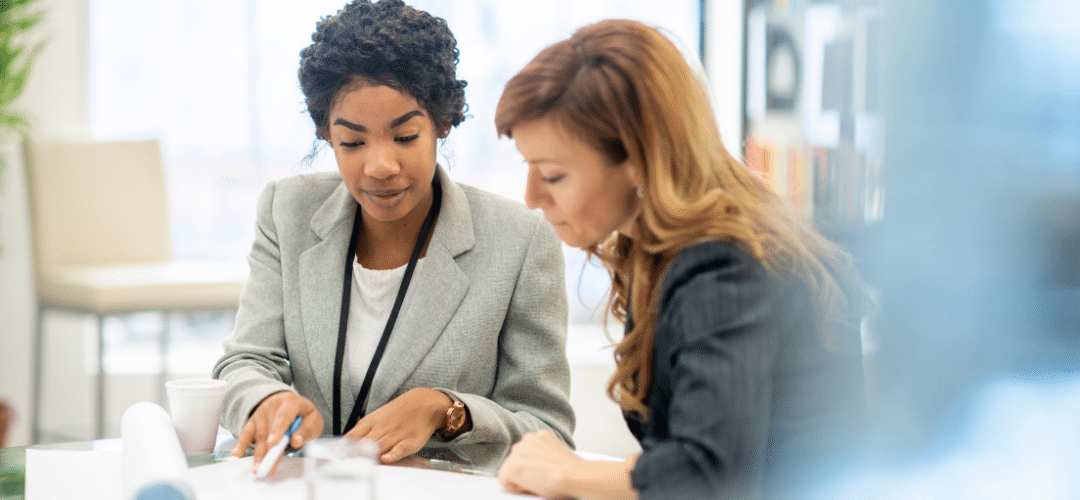 Two business women working together in an office